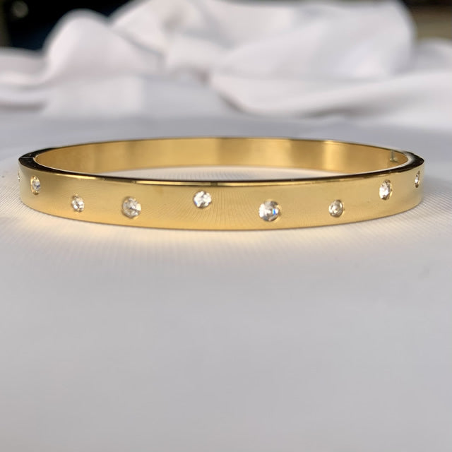 Pulsera esclava con circón irregular 6 mm dorado de acero quirúrgico