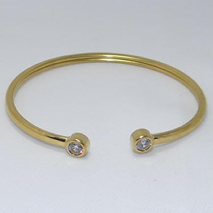 Pulsera esclava con doble circón dorado de acero quirúrgico