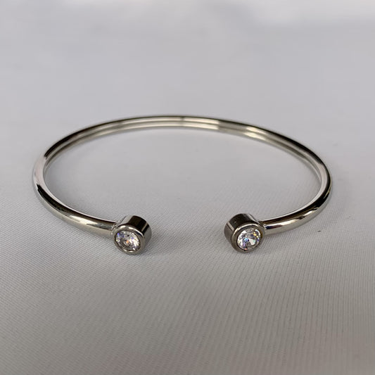Pulsera esclava con doble circón plateado de acero quirúrgico