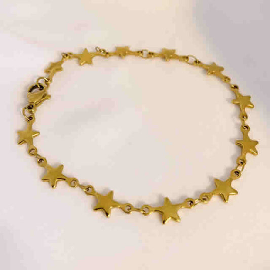 Pulsera con estrellitas continuas dorado de acero quirúrgico