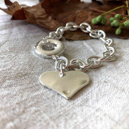 Pulsera de cadena gruesa con corazon y cierre ancla plateado de acero quirúrgico