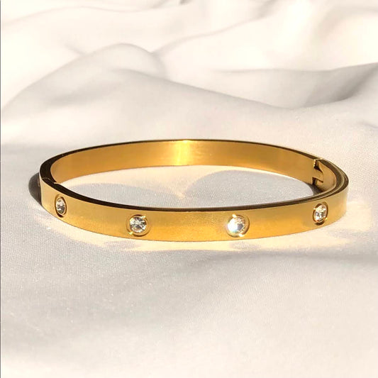 Pulsera esclava con circón 6 mm dorado de acero quirúrgico